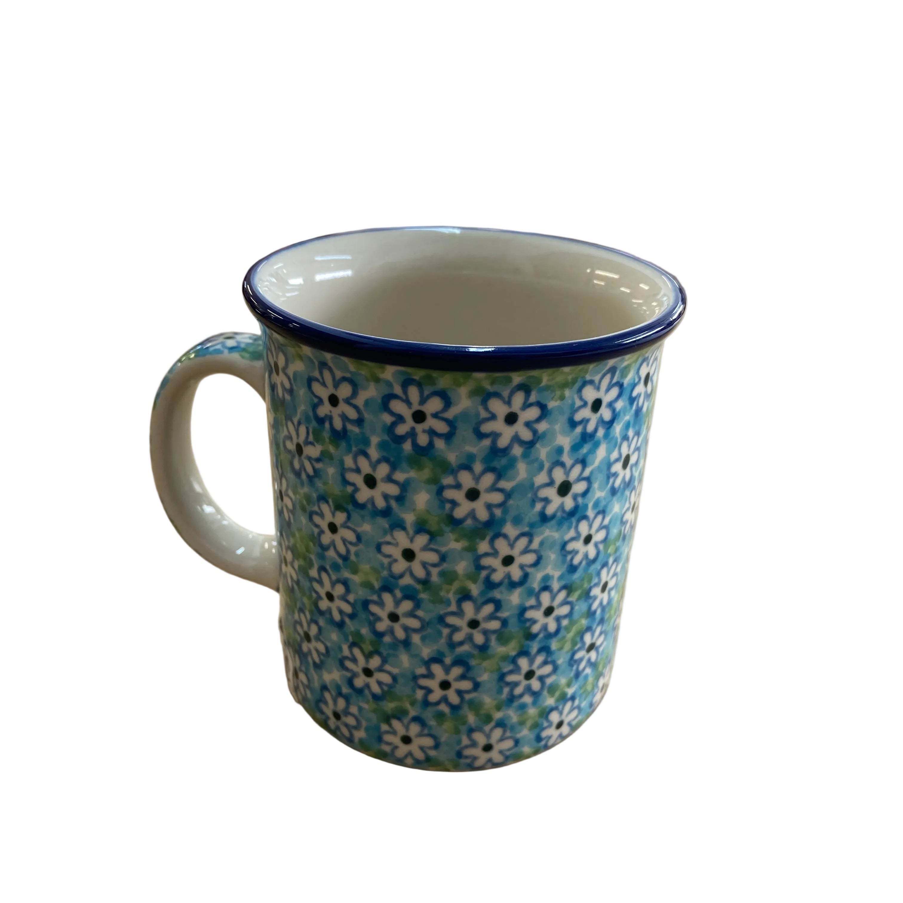 ceramic mug with a blue and white floral pattern and a dark blue rim.